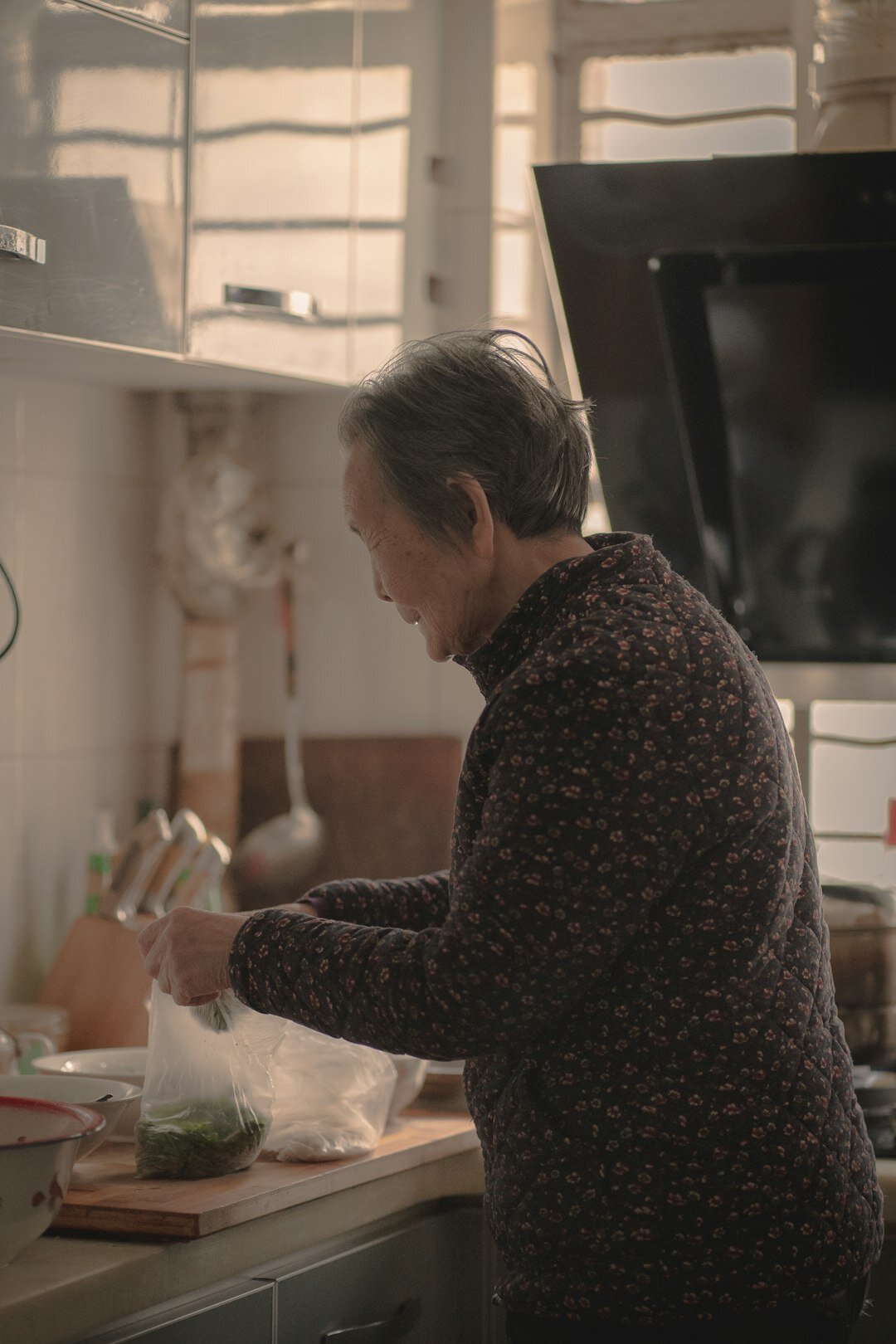 Senior Danish couple cooking together in a community kitchen
